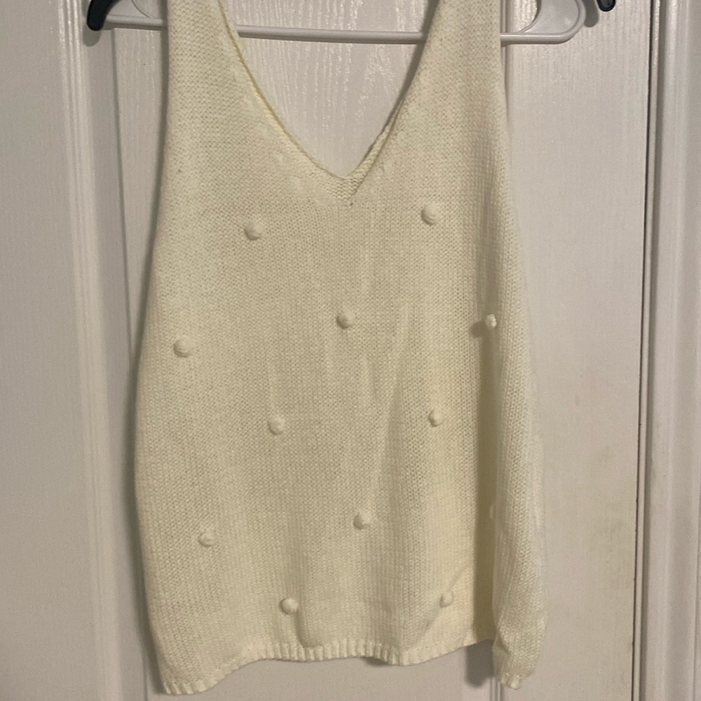Cream colored sleeveless sweater